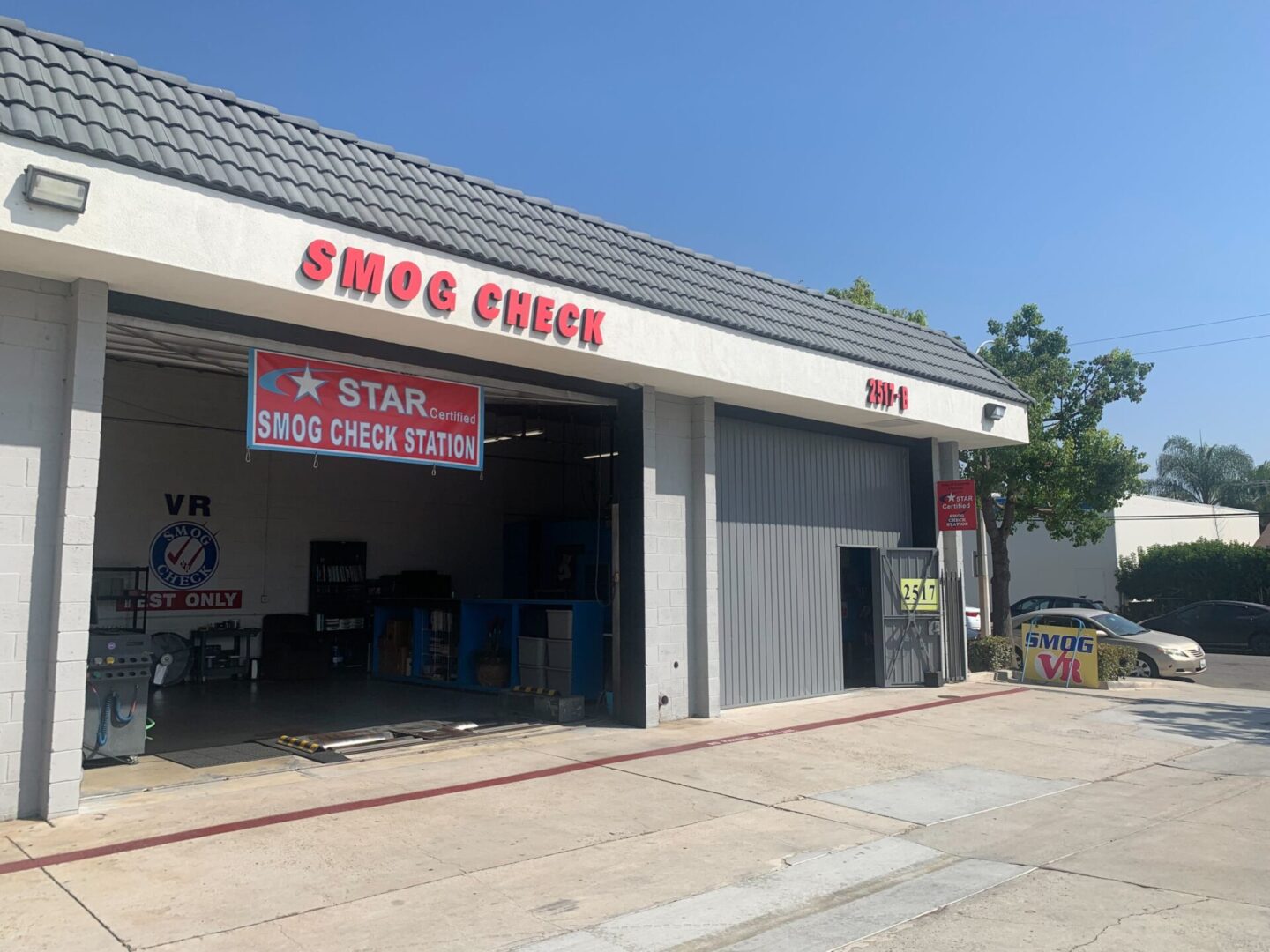 Certified technician performing smog inspection