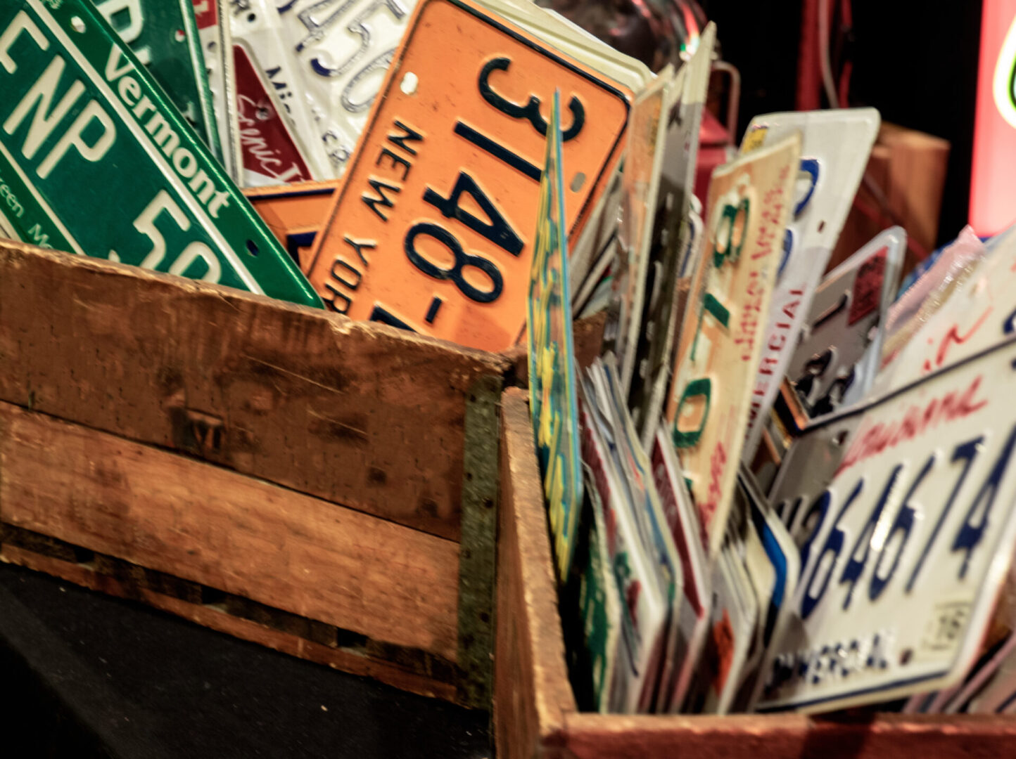 reproductions of American automobile license plates for sale in a flea market